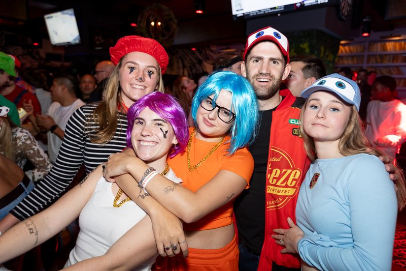 A large costumed group crowded together for a photo