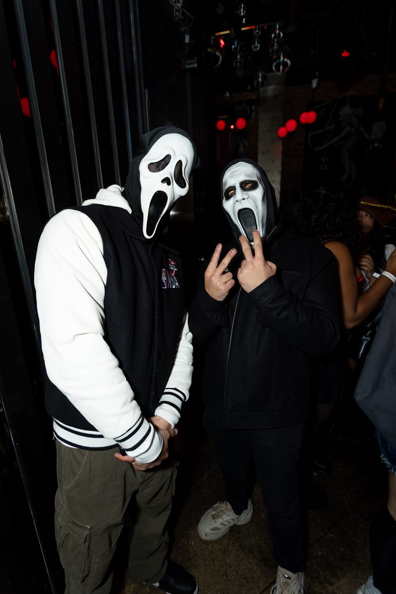Two attendees in Halloween masks at Crawlloween 2025