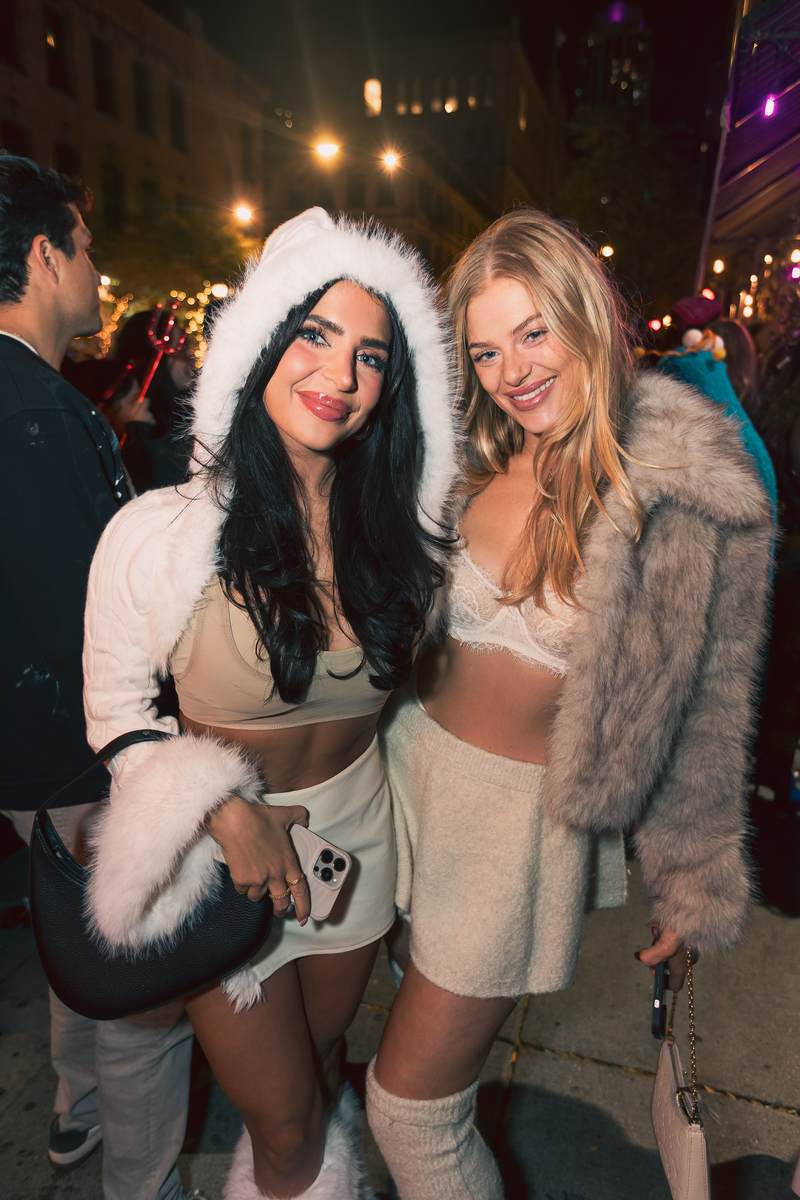 Two attendees in costume on the street during Crawlloween