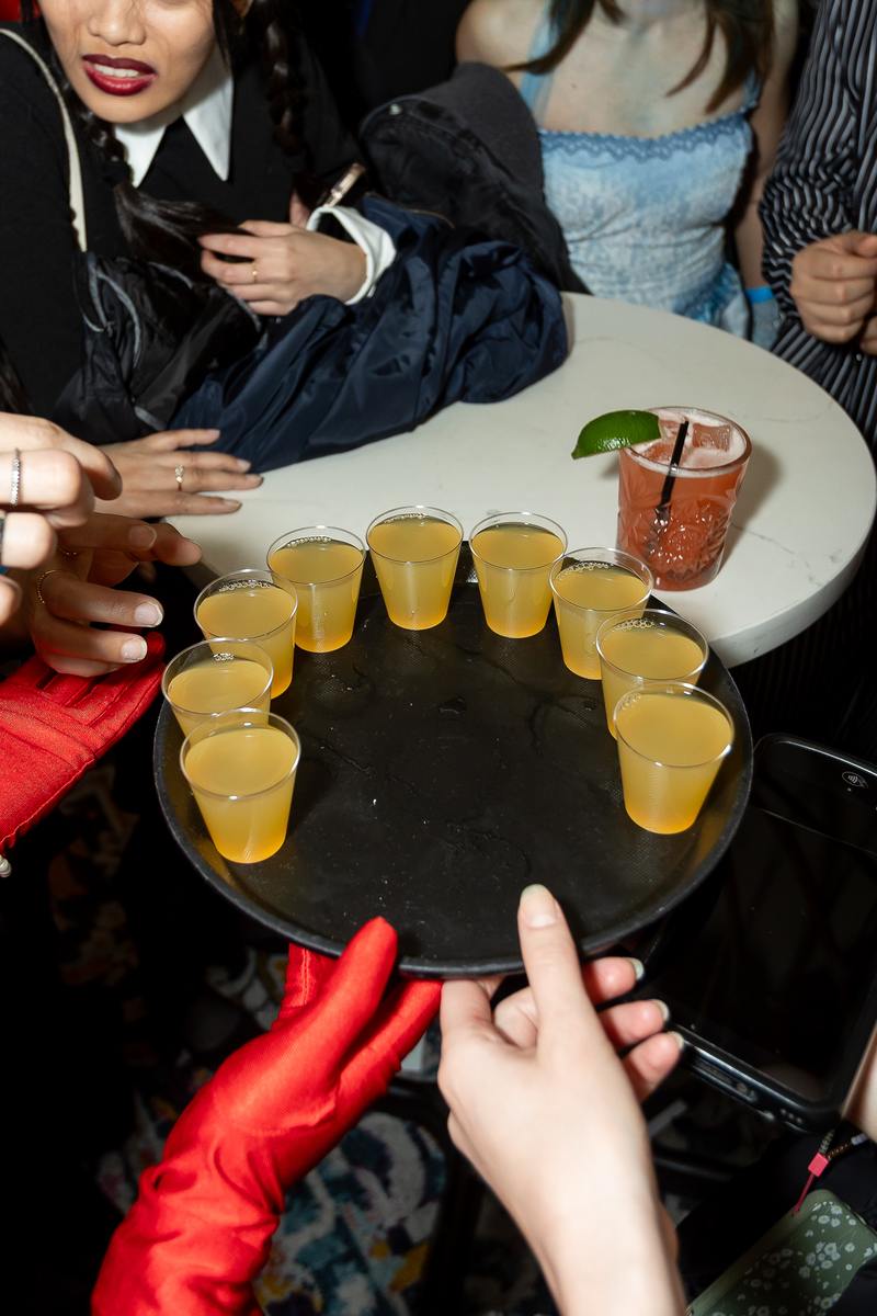 A tray of welcome shots being passed around at a Crawlloween venue