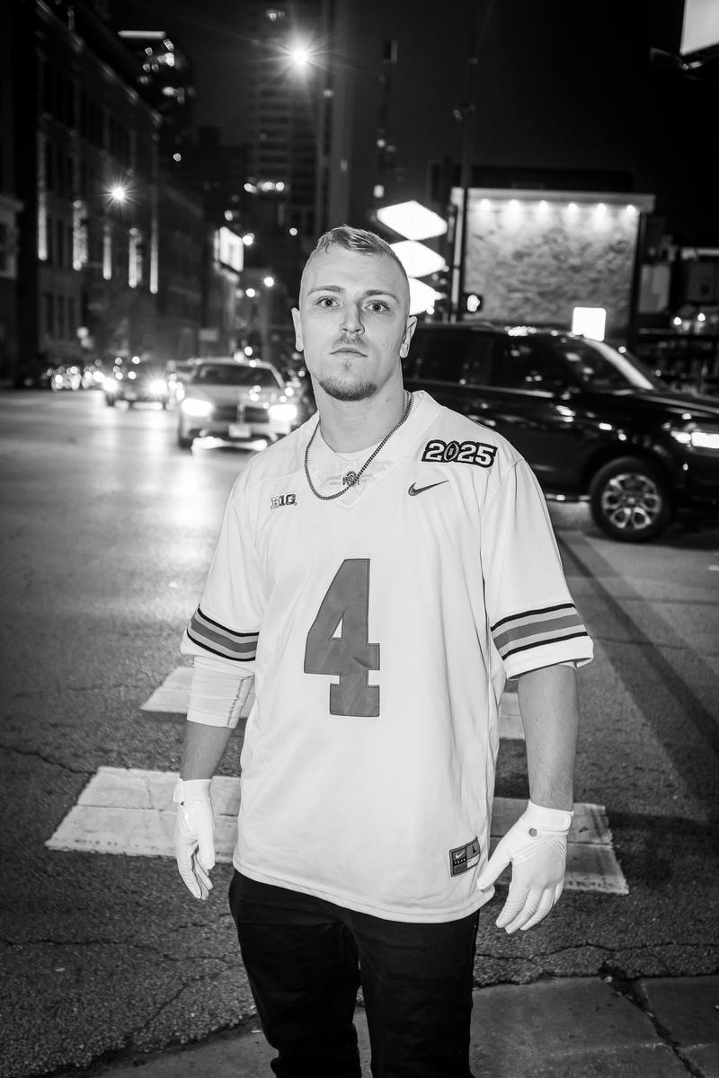 Black and white photograph of an attendee on a River North street