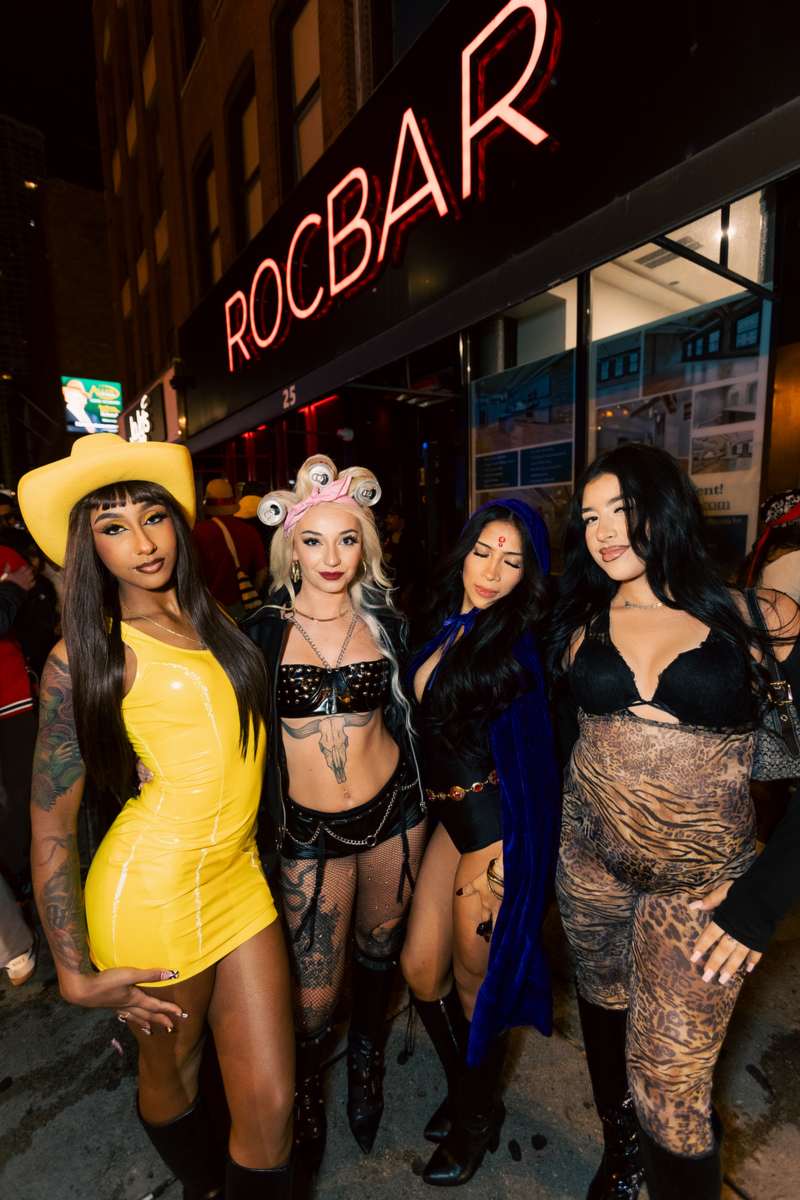 A group in costume outside ROCBAR on West Hubbard Street