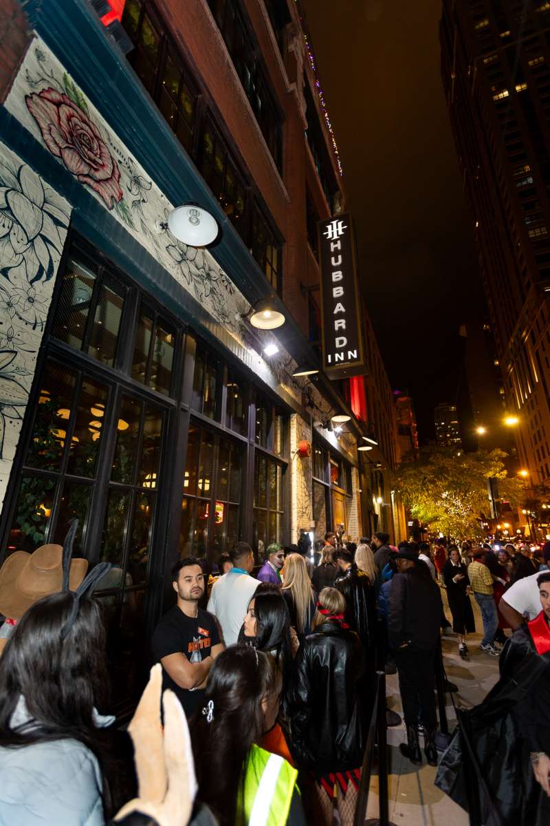 A busy River North street outside a Crawlloween venue on Halloween night